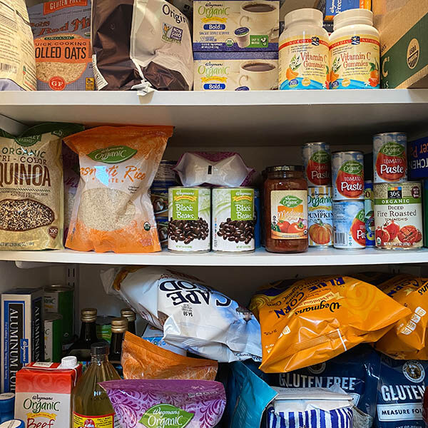 WOODBRIDGE, NEW JERSEY / USA - March 28, 2020: Dried and shelf stable food items are stored in a residential pantry, in preparation for potential Coronavirus quarantine in this illustrative editorial image.